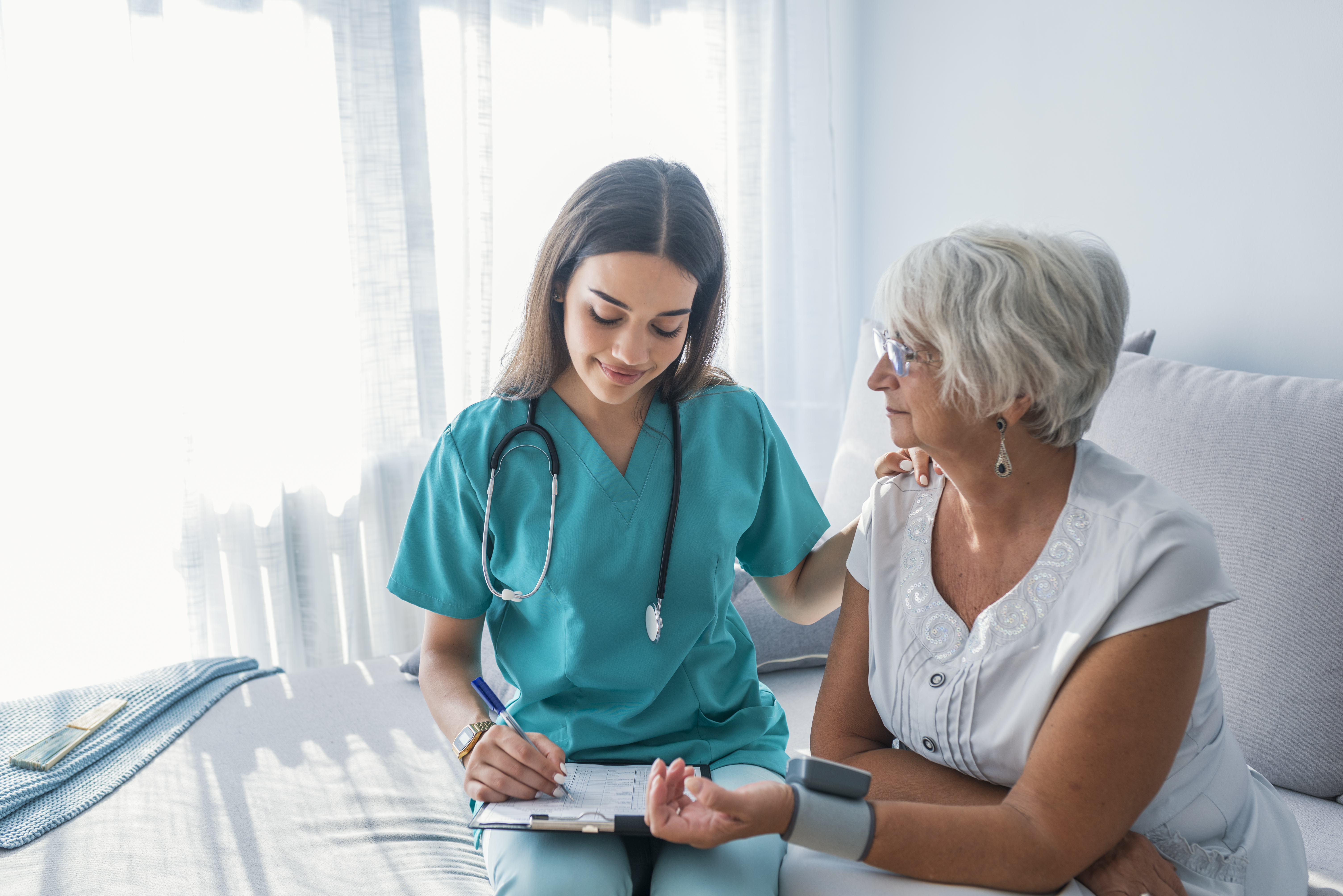 nurse and older adult patient