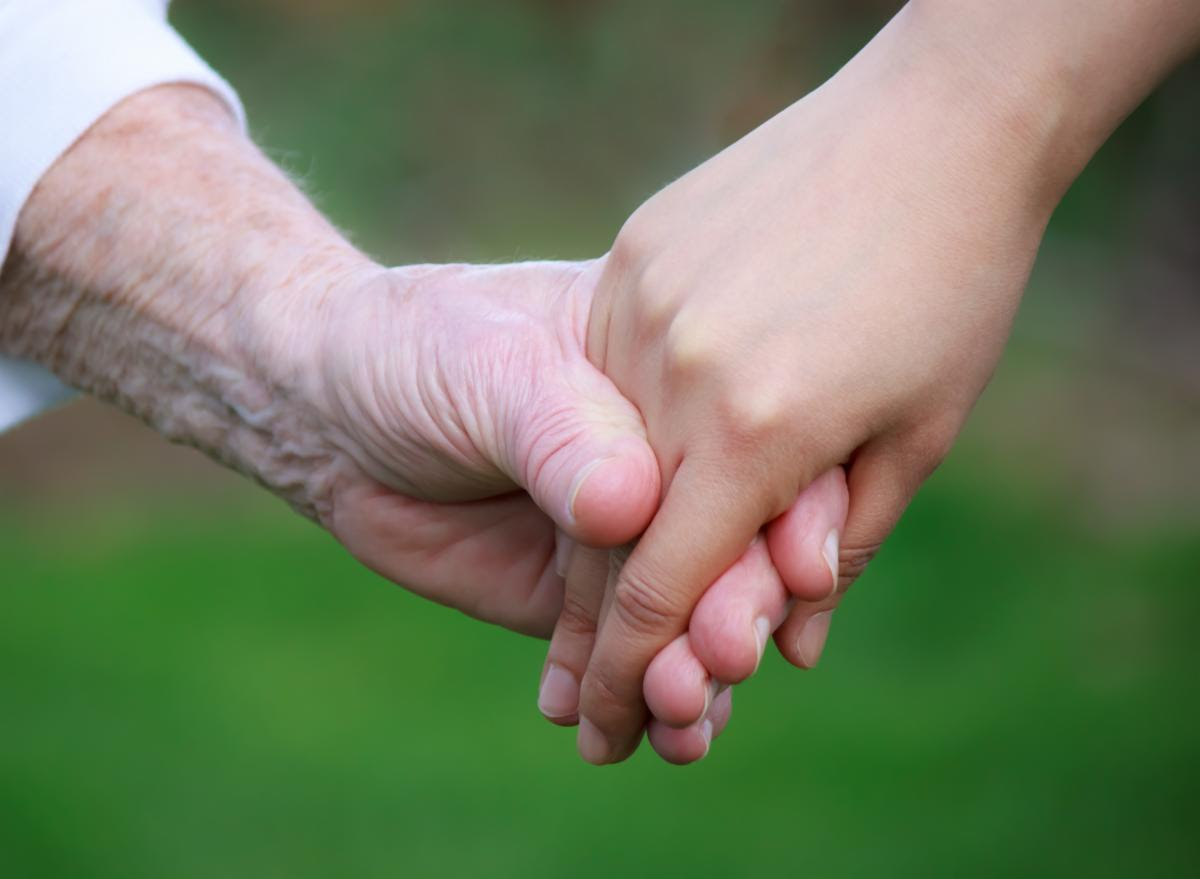 older adult and youth adult hands