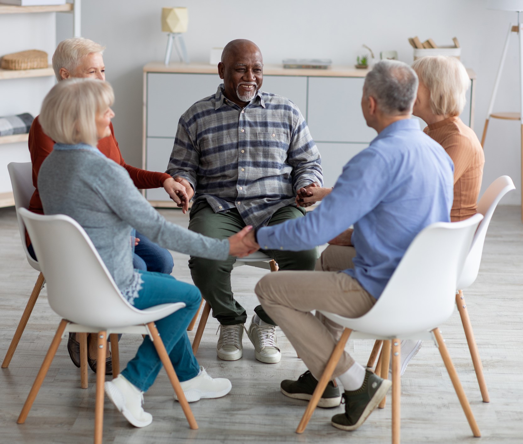 group of older people sitting in circle